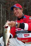 zell rowland holds a bass caught on a rebel pop-r